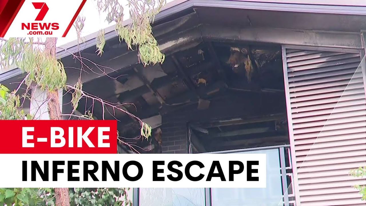 Elderly couple jump from balcony after e-bike battery explodes | 7NEWS