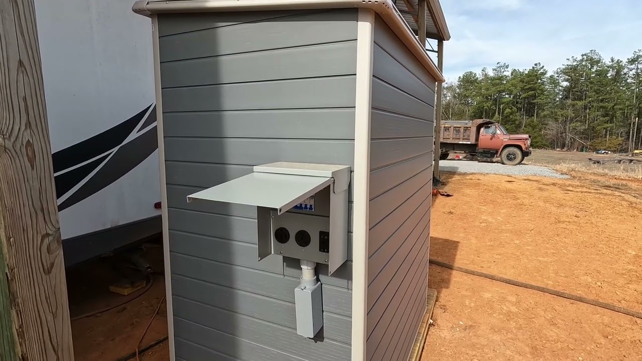 Update install pre-wired Rv panel box & conduit box in solar power shed on homemade skid platform