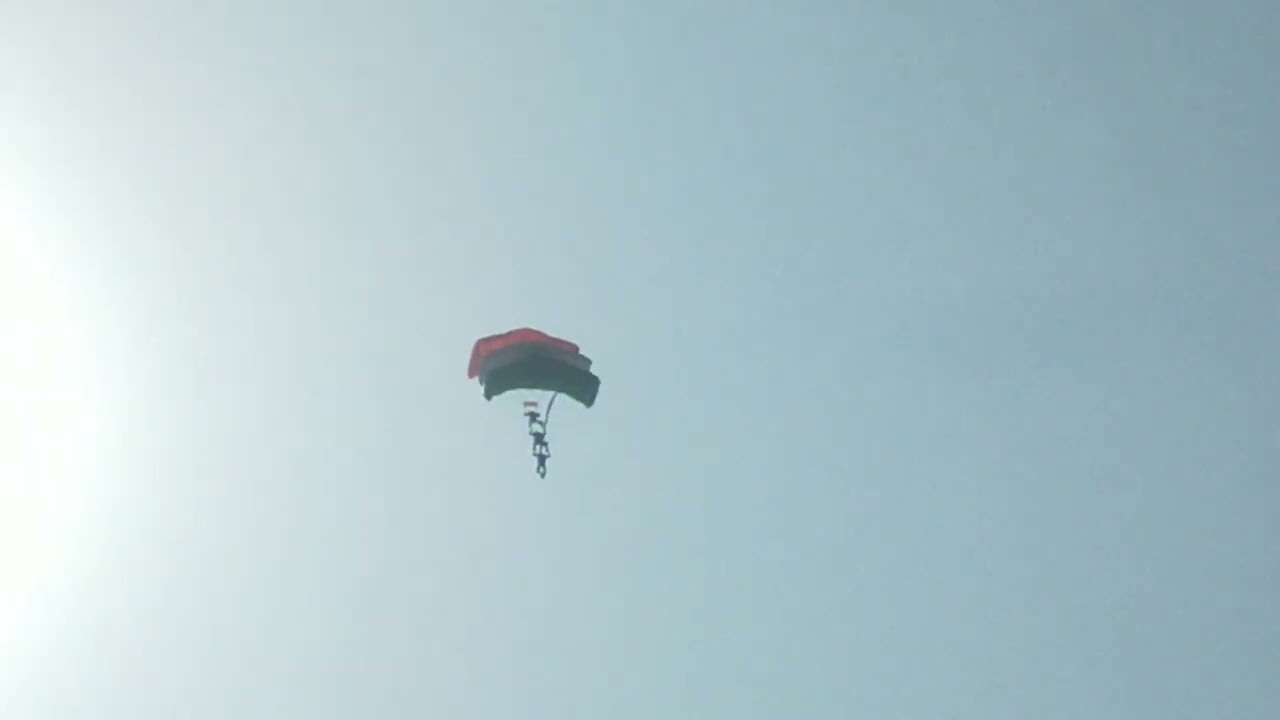 Three man together showing India's flag in the air on 91th IAF day