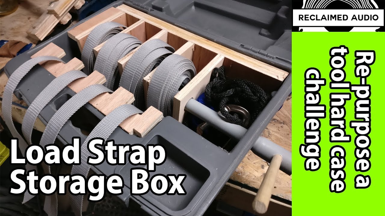 Load strap winder/storage made from a saw case.
