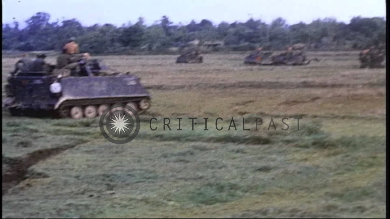 Soldiers aboard M113 APCs moving along the rice paddies in Chu Lai, Vietnam durin...HD Stock Footage