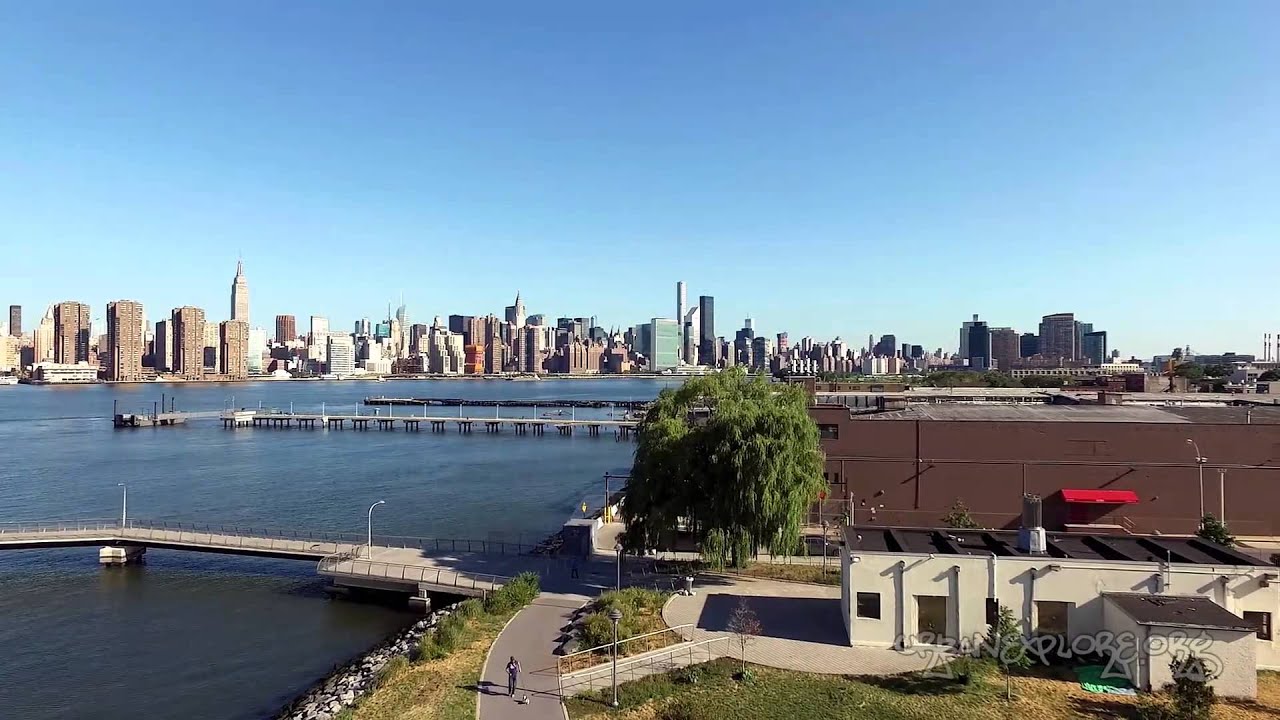 NYC Skyline from Transmitter Park - drone aerial fly over Brooklyn New York City