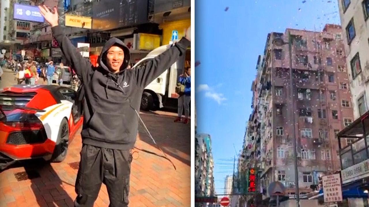 Man Causes Mad Dash by Throwing Money From Hong Kong Roof