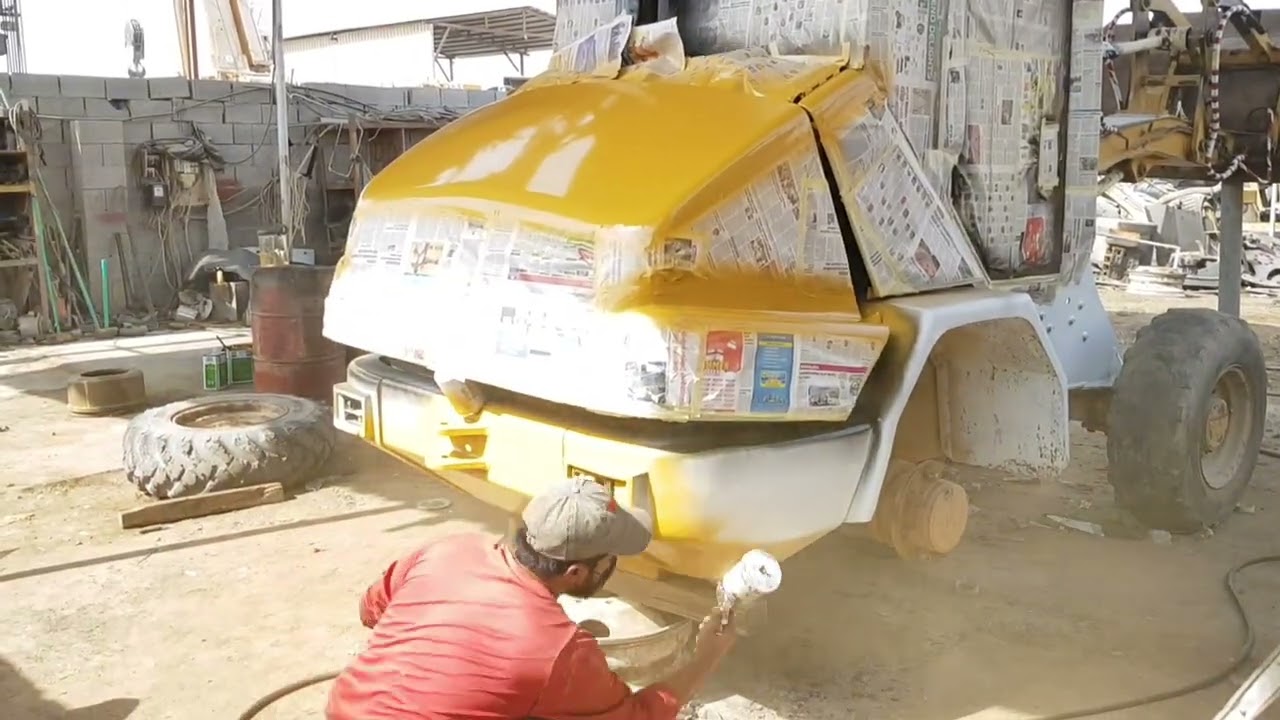 loader CAT 906 DAinting painting EMArat  ABU DHABI
