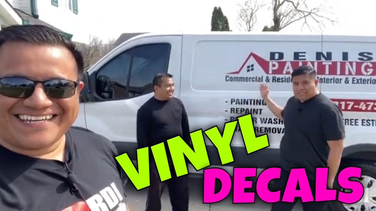 Applying decals on work van