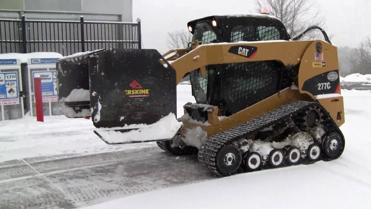 Cat 277C Plowing Snow