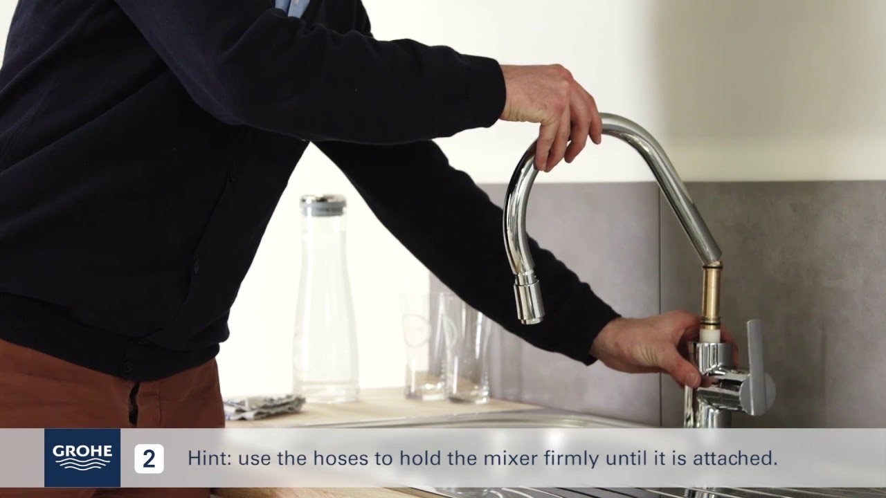 Install a GROHE single lever kitchen mixer with pullout mixer spout