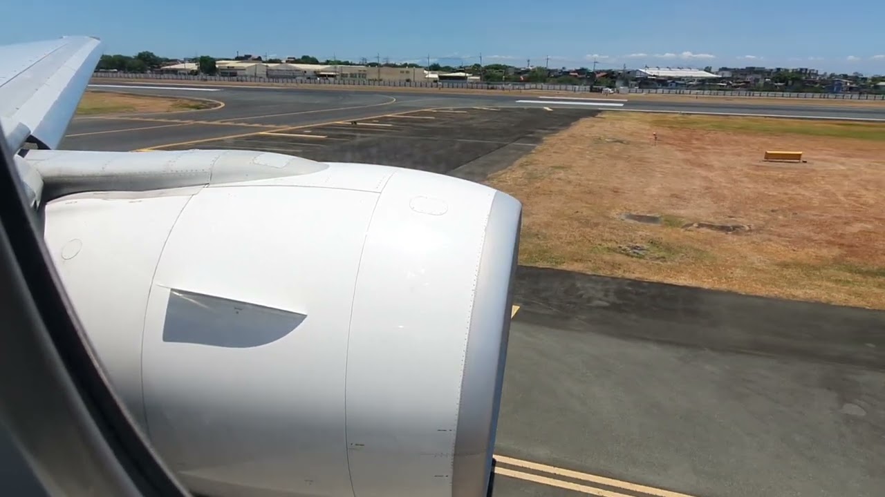 Powerful take off thrust by GE90 of Philippine Airlines 777 (with Manila view)