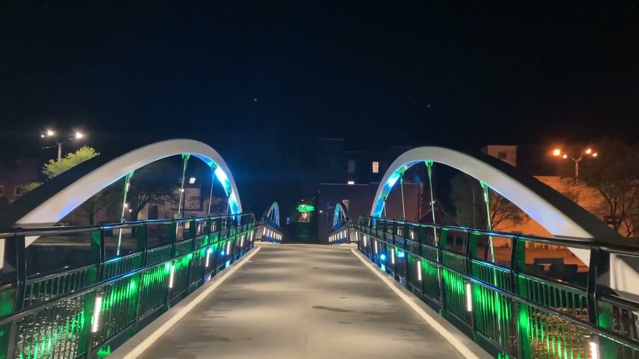 Walkway over the Mora River at night