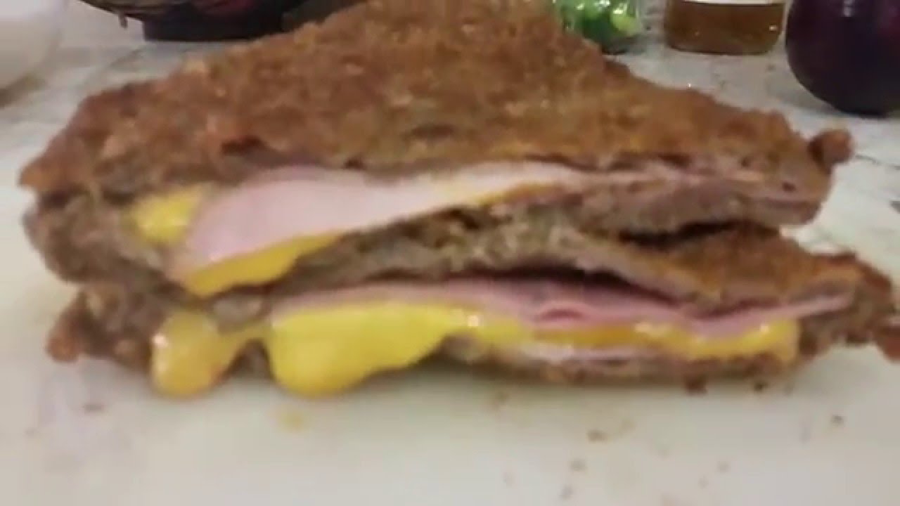 Bistec empanizado  relleno de jamon y queso. receta