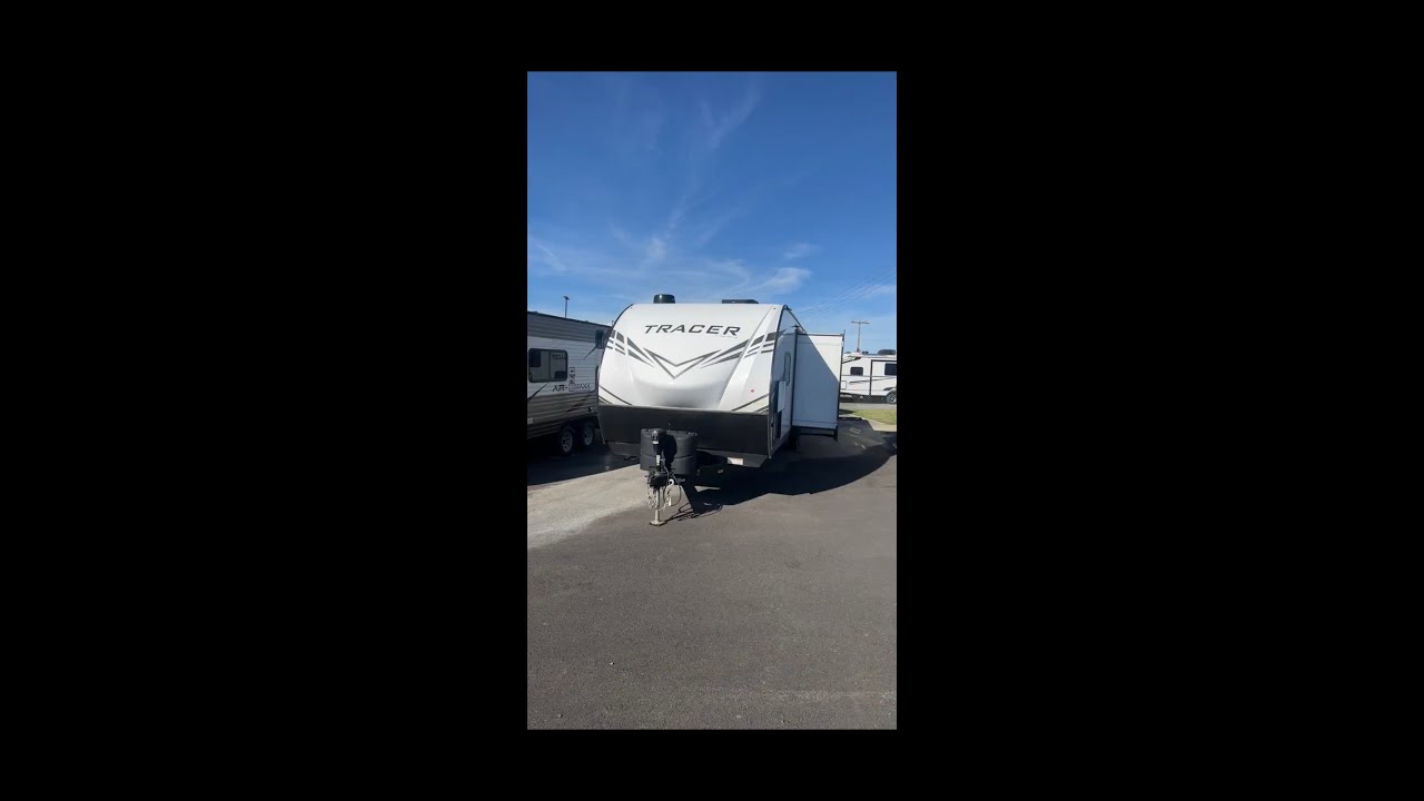 Location of switch for rear stabilizer jacks on Prime Time Tracer travel trailer