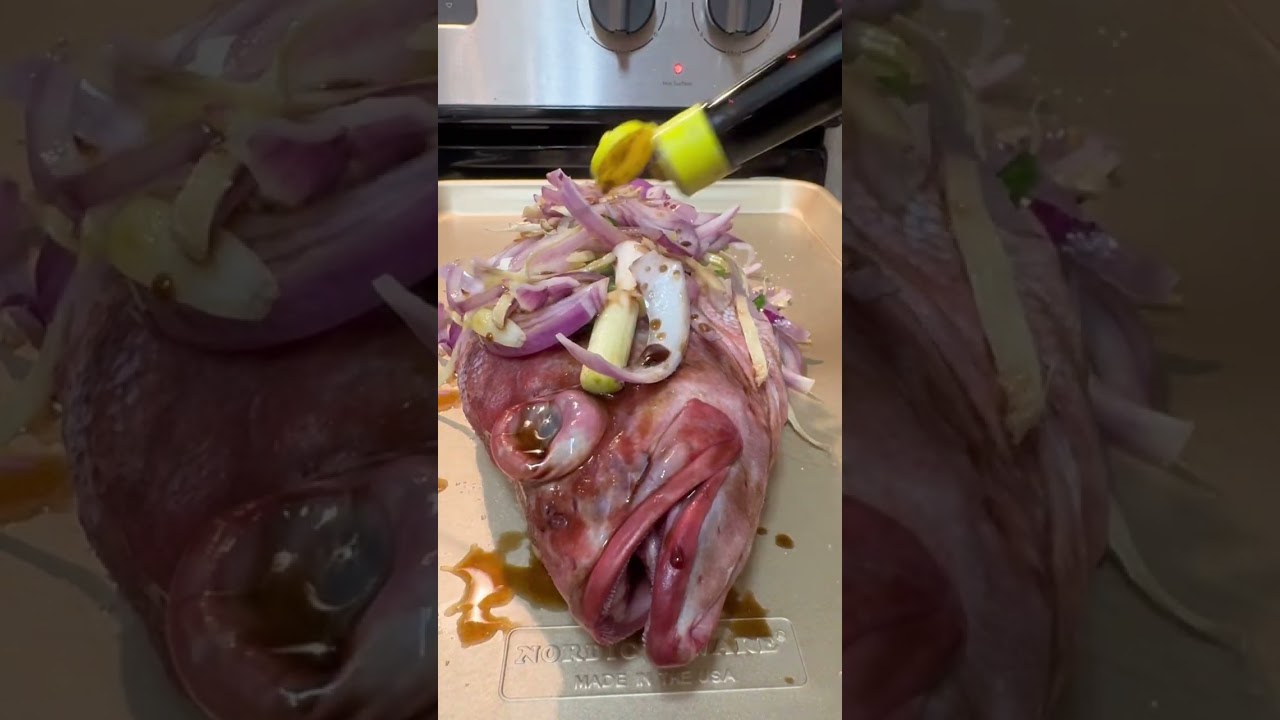 Baked Rockfish - Bedded with Lemon, with Ginger, Garlic, Onion & Scallions. 