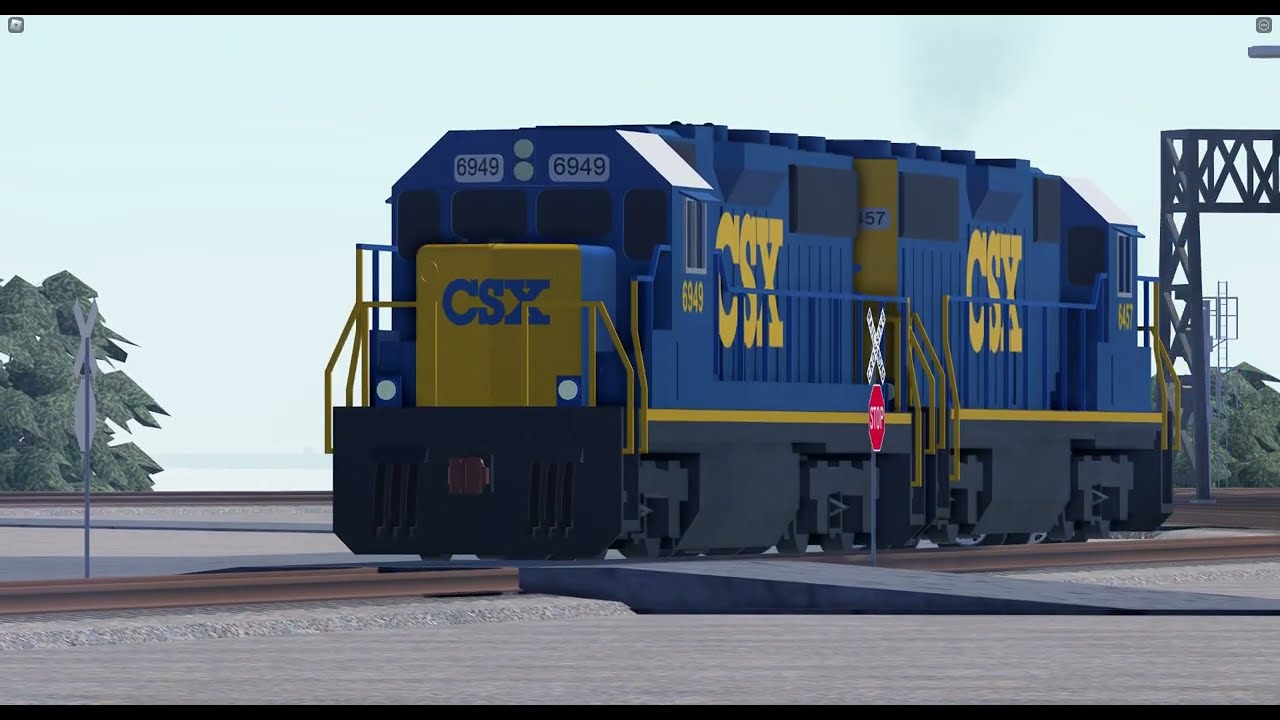 CSX GP40-2's pull a flatcar with Steam Engine parts on it out of the Queensgate Engine shops