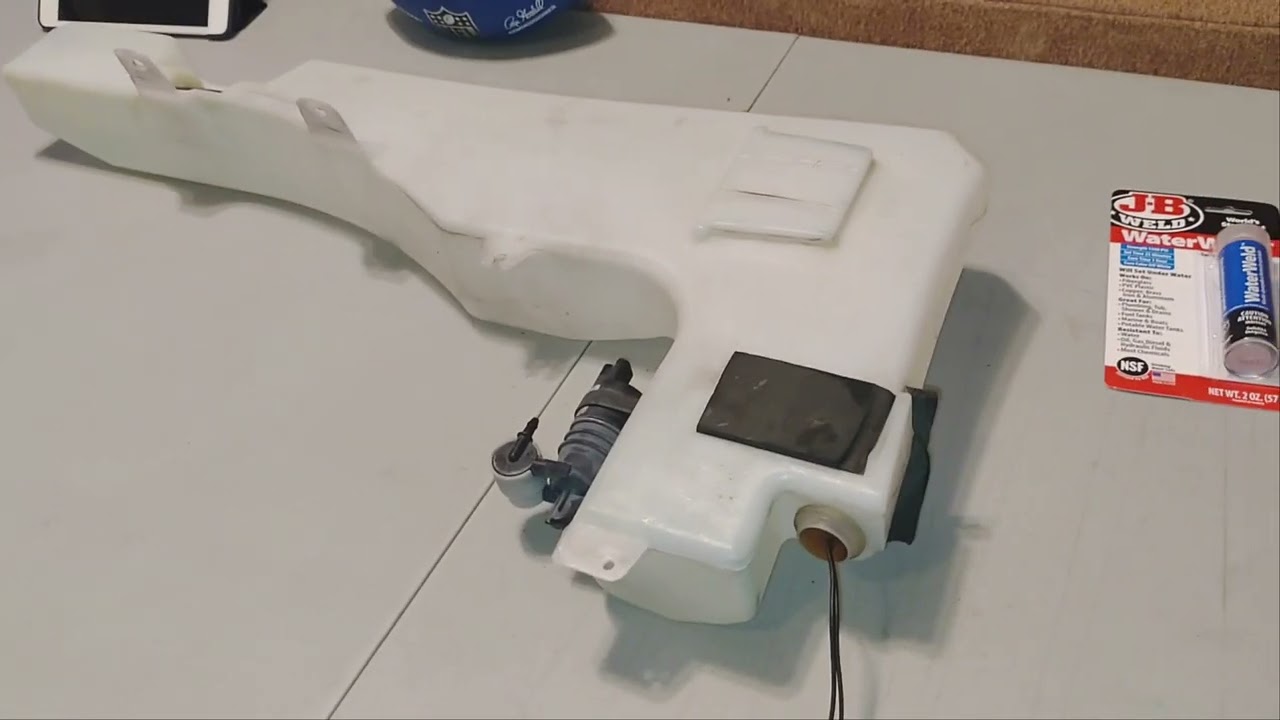 How to repair windshield washer reservoir Nissan Xterra 2005