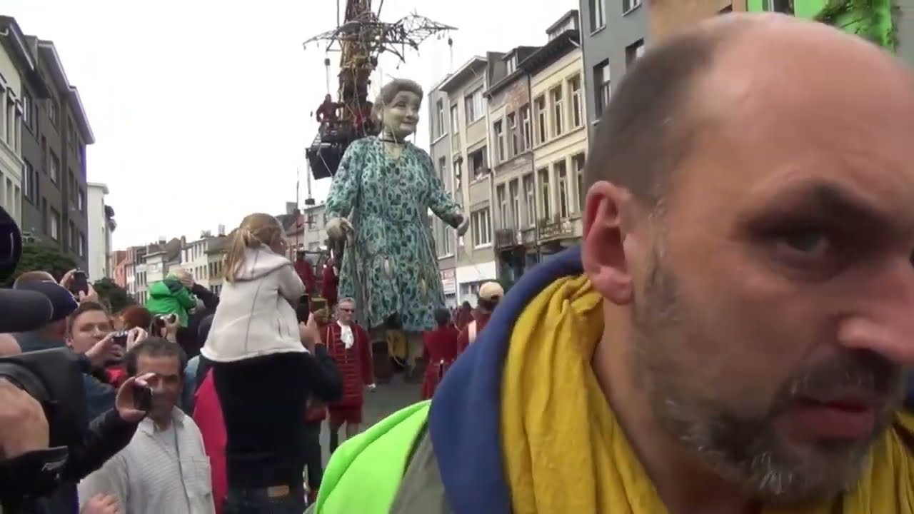 grandma giant walks through the streets to the music