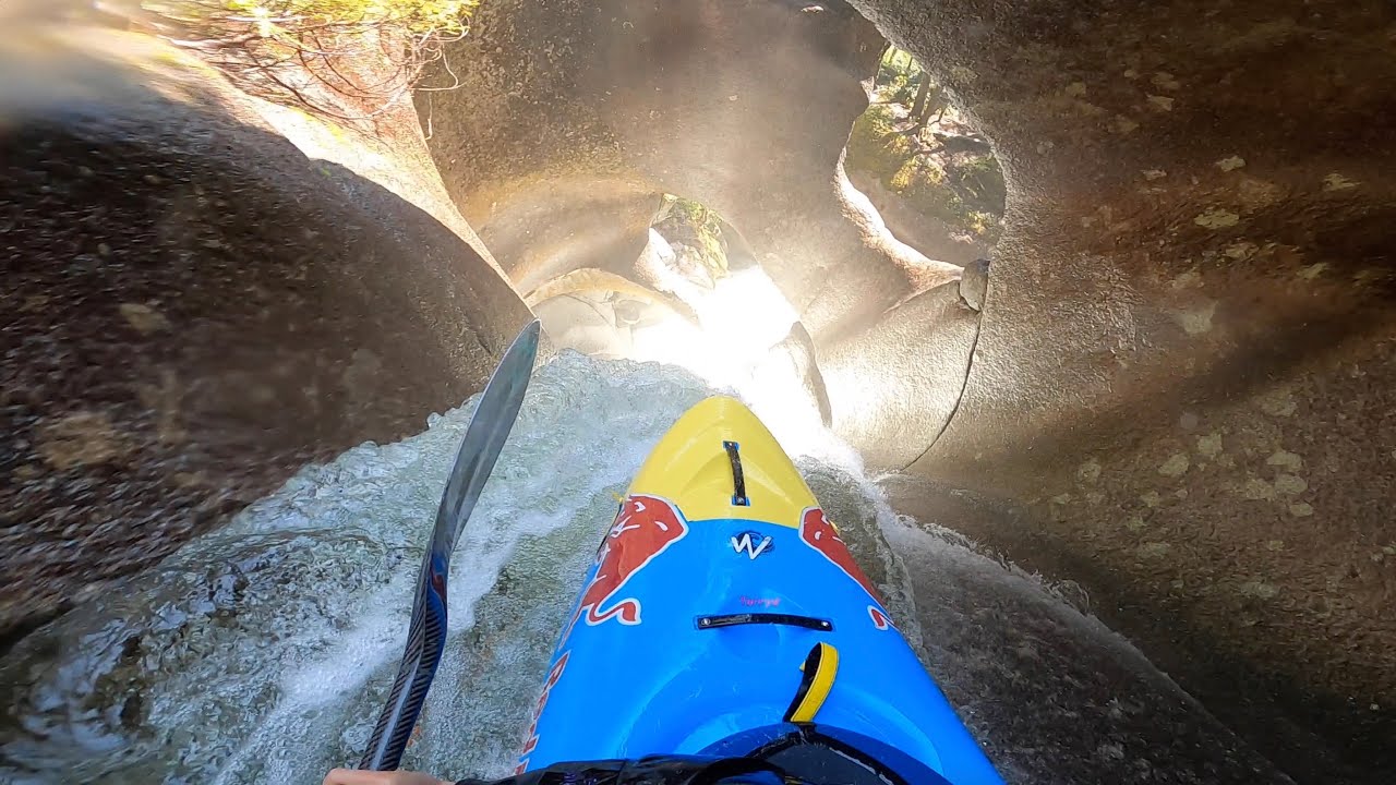 Kayaking through a crazy 50ft Tunnel Waterfall.