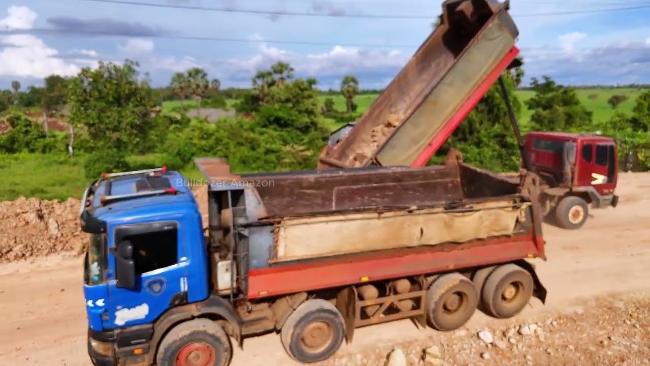 Greatest teamwork fast filling substrate foundation stretching by expert dozer d41p &truck unloading