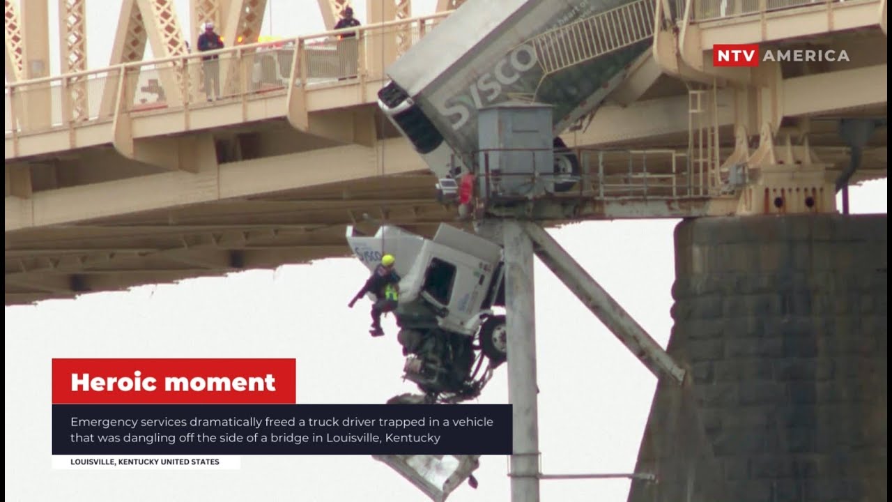 Driver rescued from truck dangling from Kentucky bridge