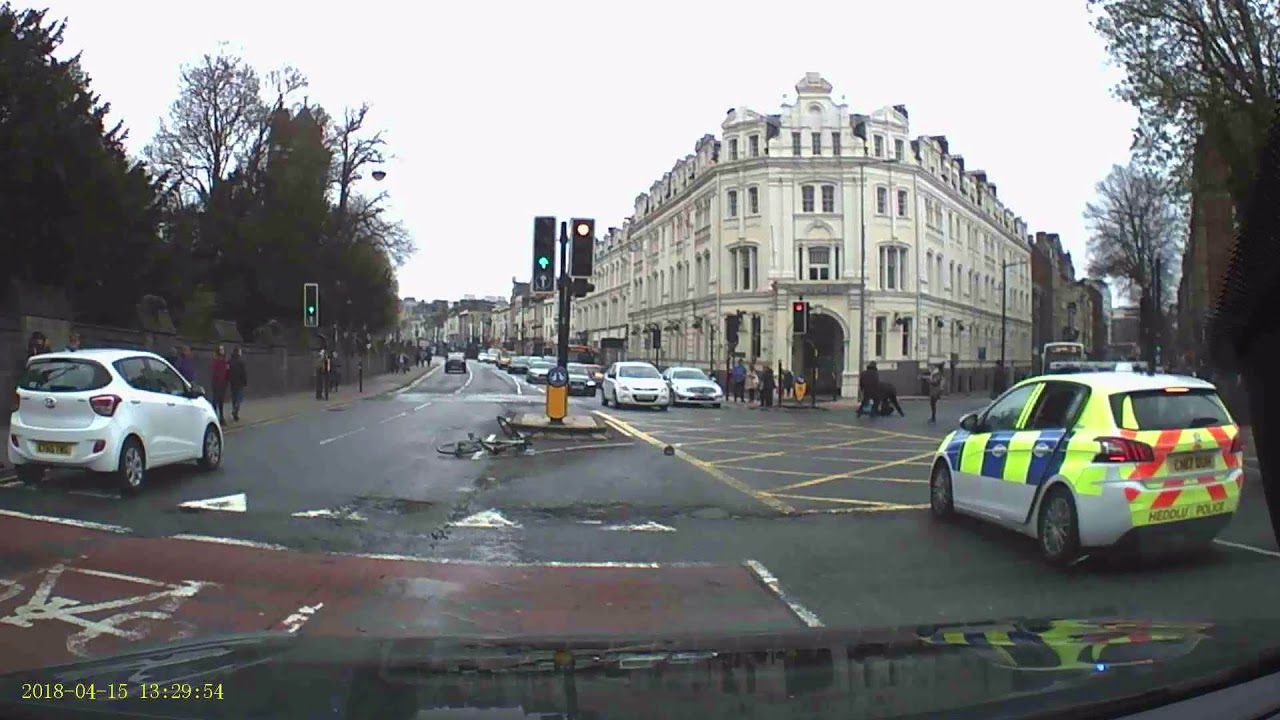 Dashcam Shows Pedestrians Tackle Knife-Carrying Cyclist Fleeing Cardiff Police