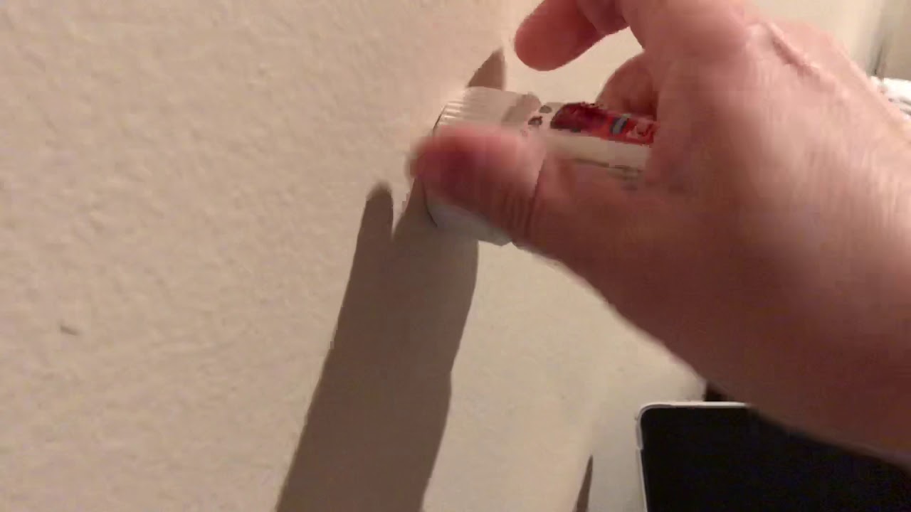 Opening a child safe medicine bottle with one hand.
