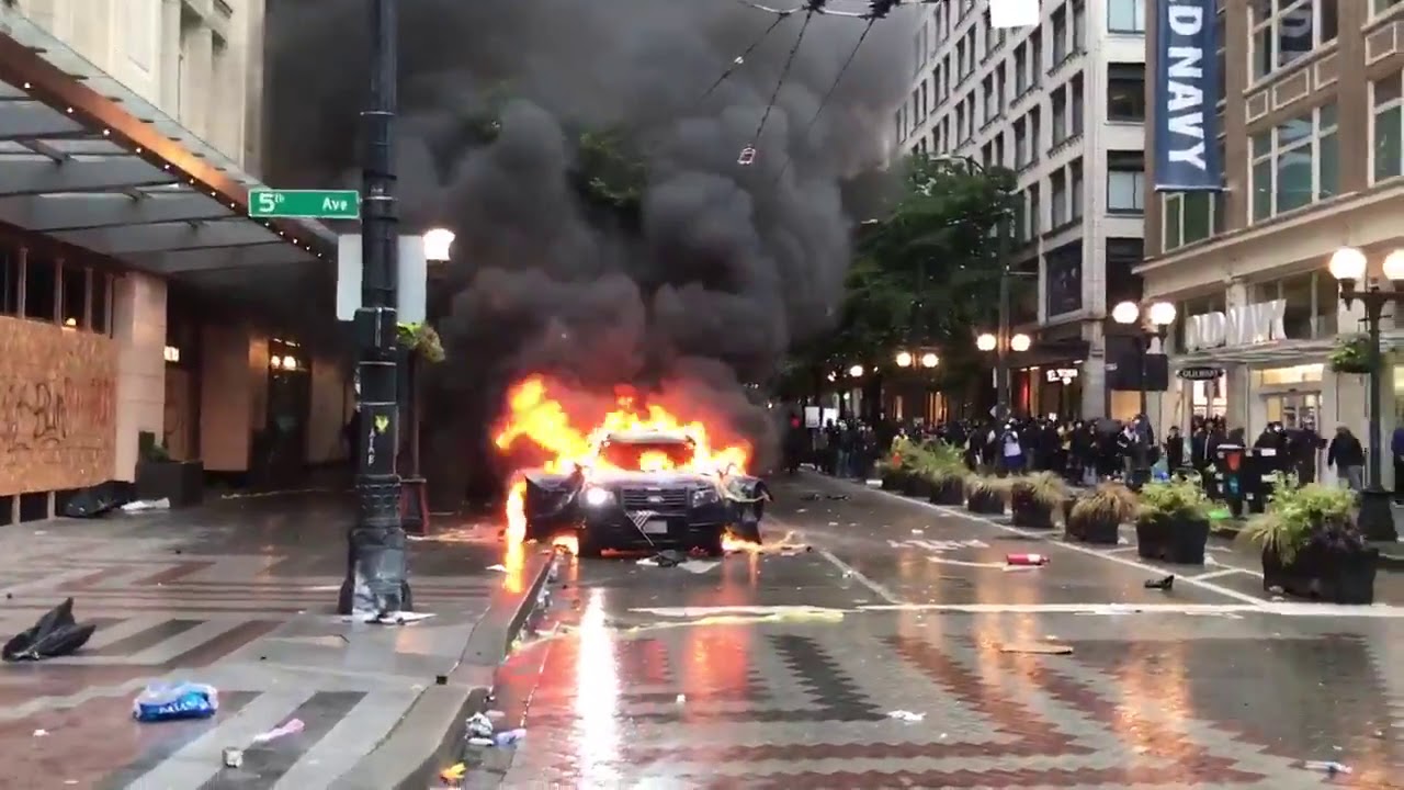 Police cars burned during George Floyd protests.