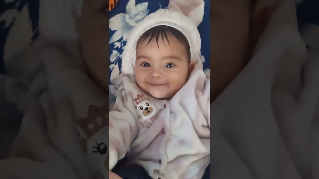 My cute daughter holding her feet and putting in the mouth 👄...six months and 15 days old