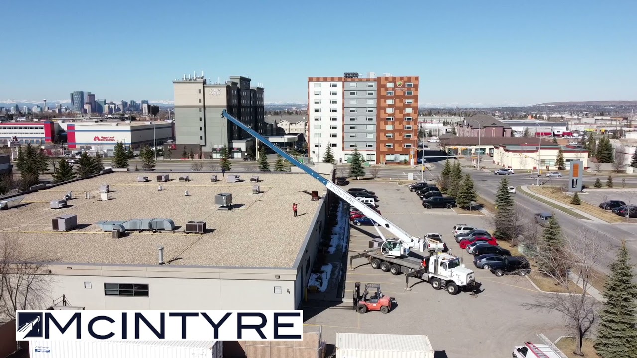 McIntyre Crane & Rigging - Hoisting a Hvac unit in Calgary, Alberta