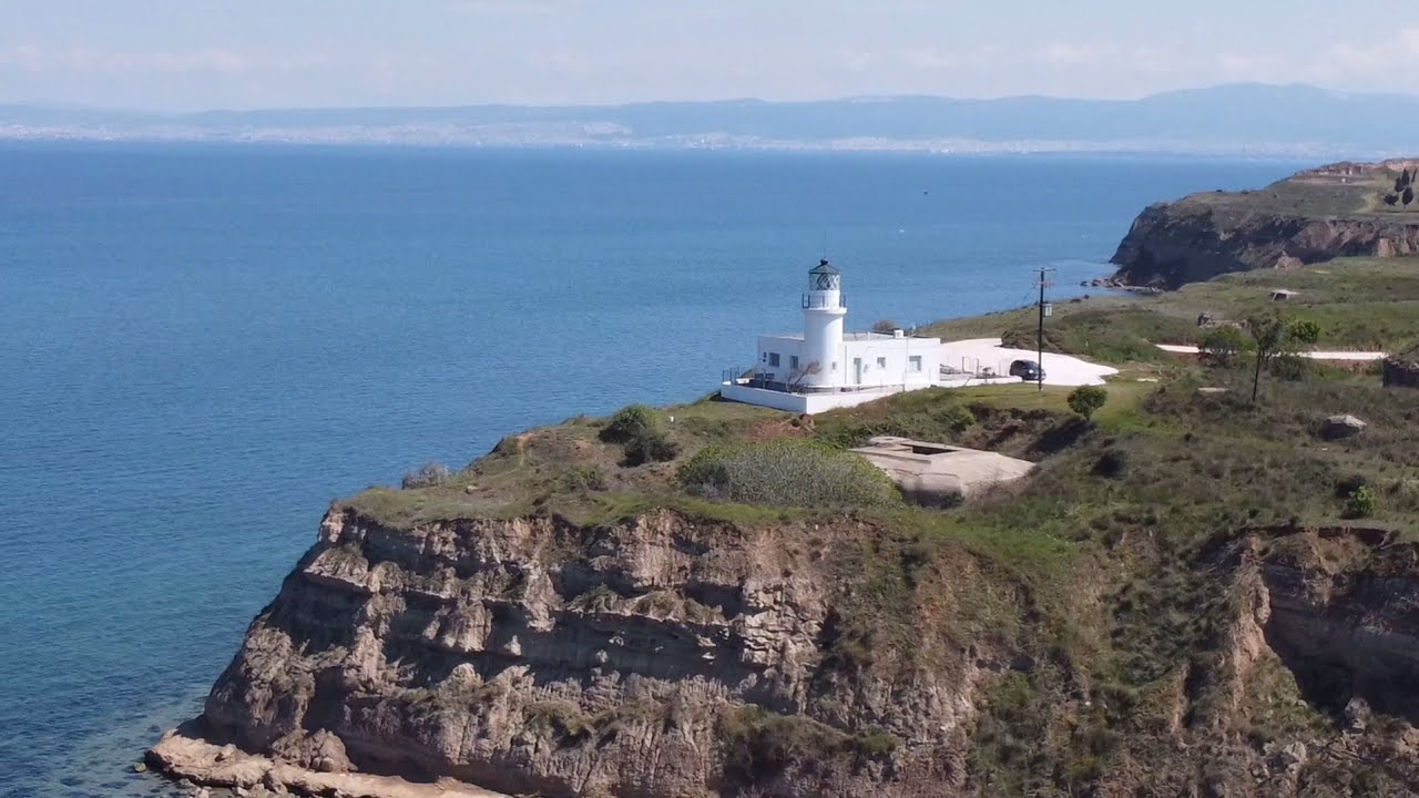 A white lighthouse | A fishing village | A cargo ship at 2,5km from the coastline | Dji mini 2