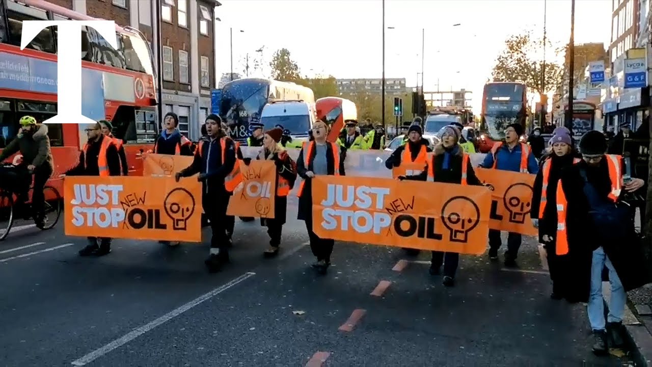 Just Stop Oil protesters block traffic as they march in south London