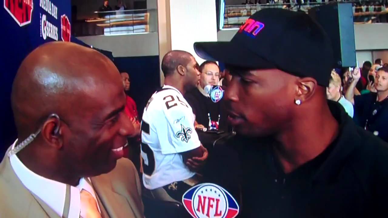 Deon Sanders gives Ocho Cinco a child please at superbowl XLIV media day
