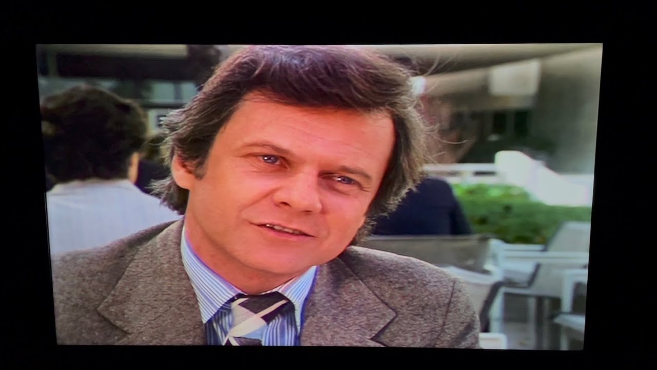 Dallas: Cliff Barnes makes a deal with Julie Grey.