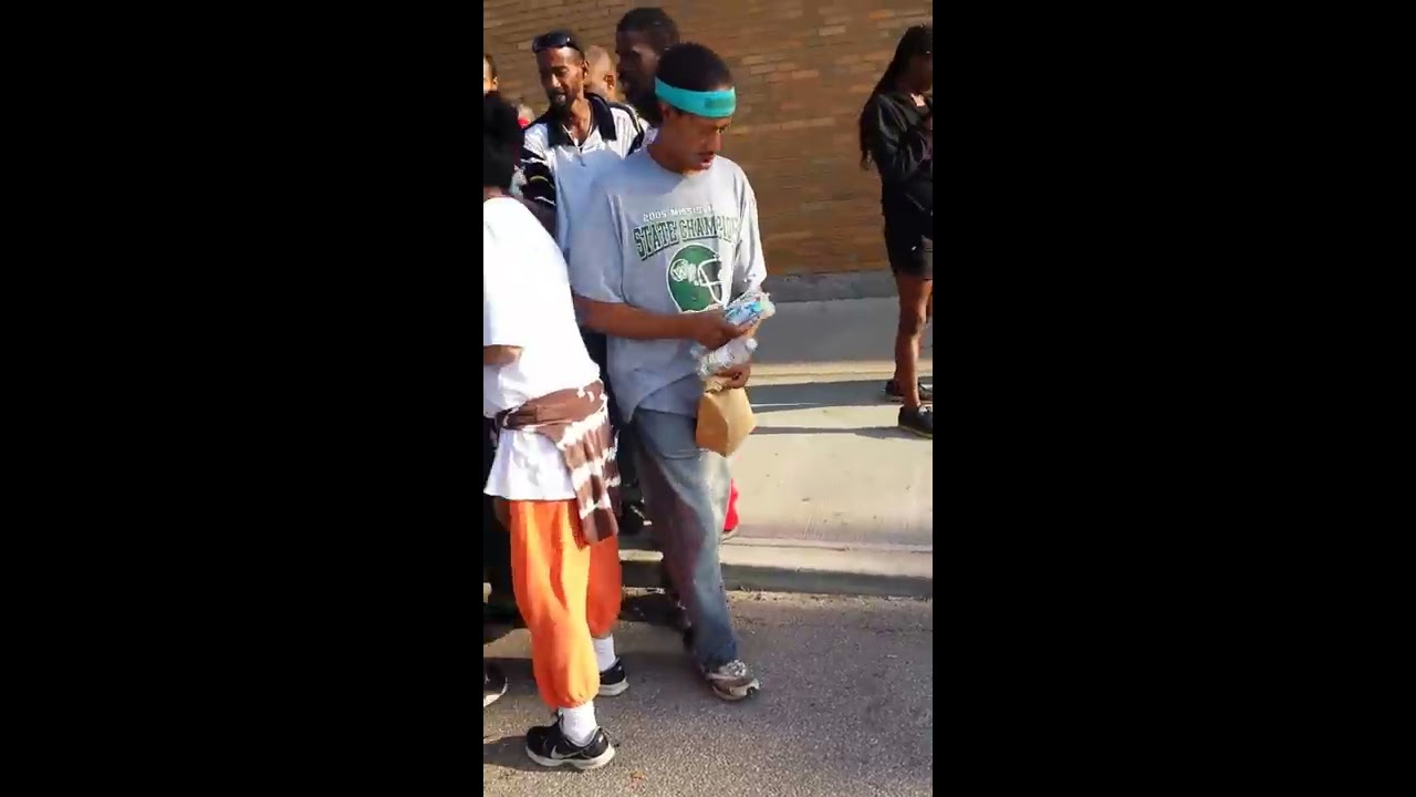 Passing out food and care packages to the homeless.