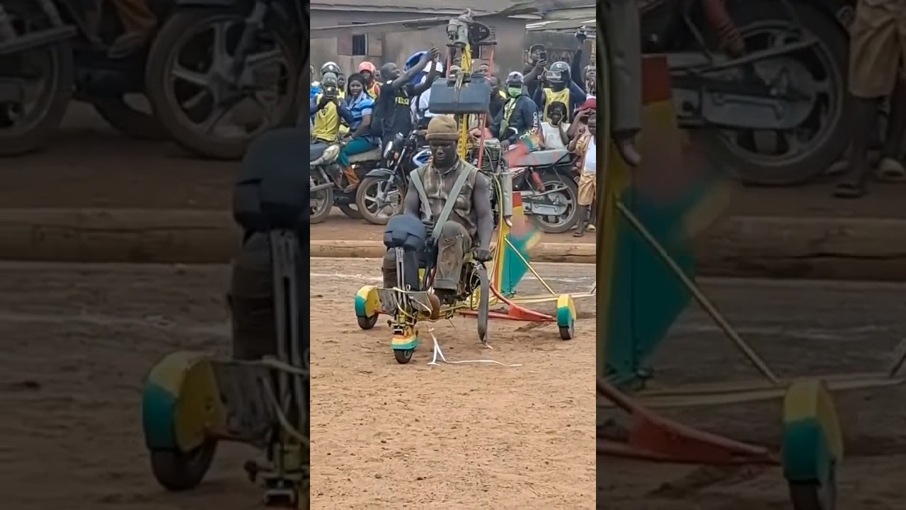 African man showcases his homemade helicopter to his village people.