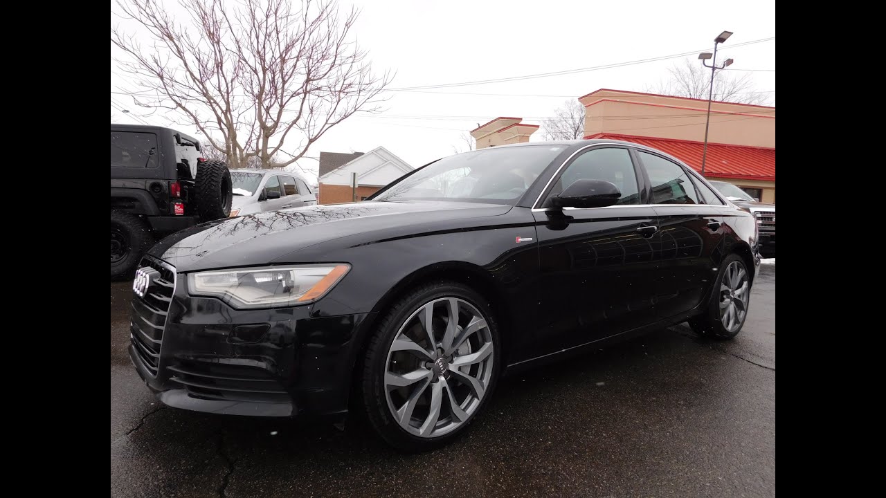 Audi A6 3.0T Quattro Premium Plus 2013 года — цвет «Phantom Black», 20-дюймовые диски Audi, обслу...