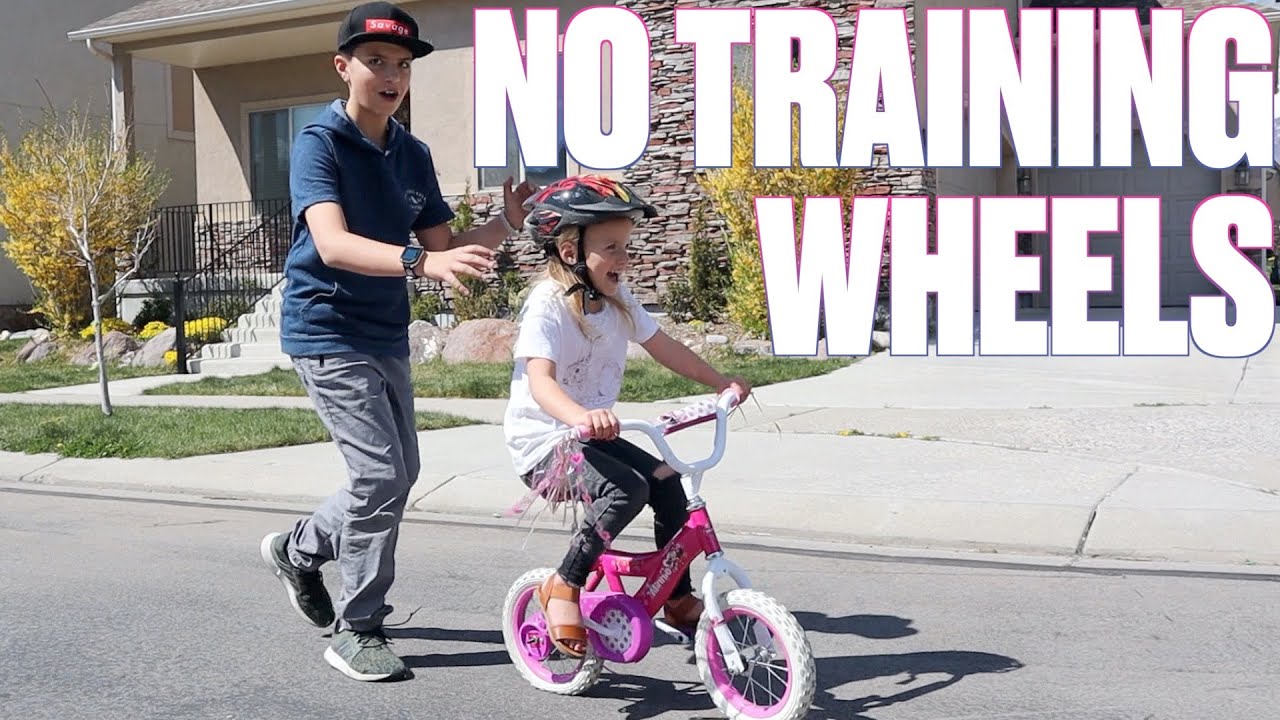 OLDER BROTHER TEACHES LITTLE SISTER HOW TO RIDE A BIKE FOR THE FIRST TIME ON NATIONAL SIBLINGS DAY
