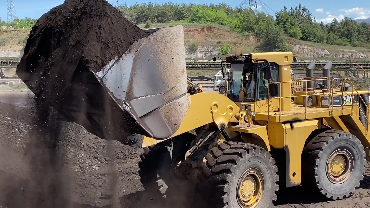 Caterpillar 990 Wheel Loader Loading Trucks - Orestis Operating Loaders For 45 Years!!