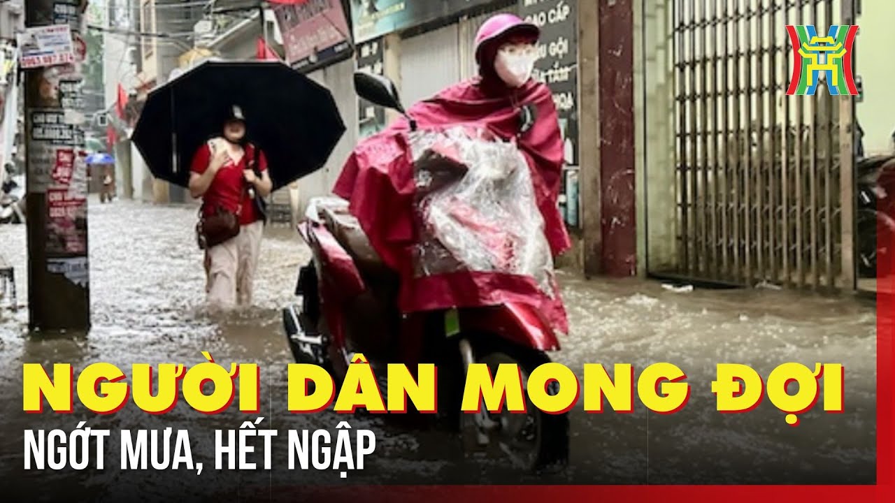 Người dân mong mưa ngớt để hết ngập