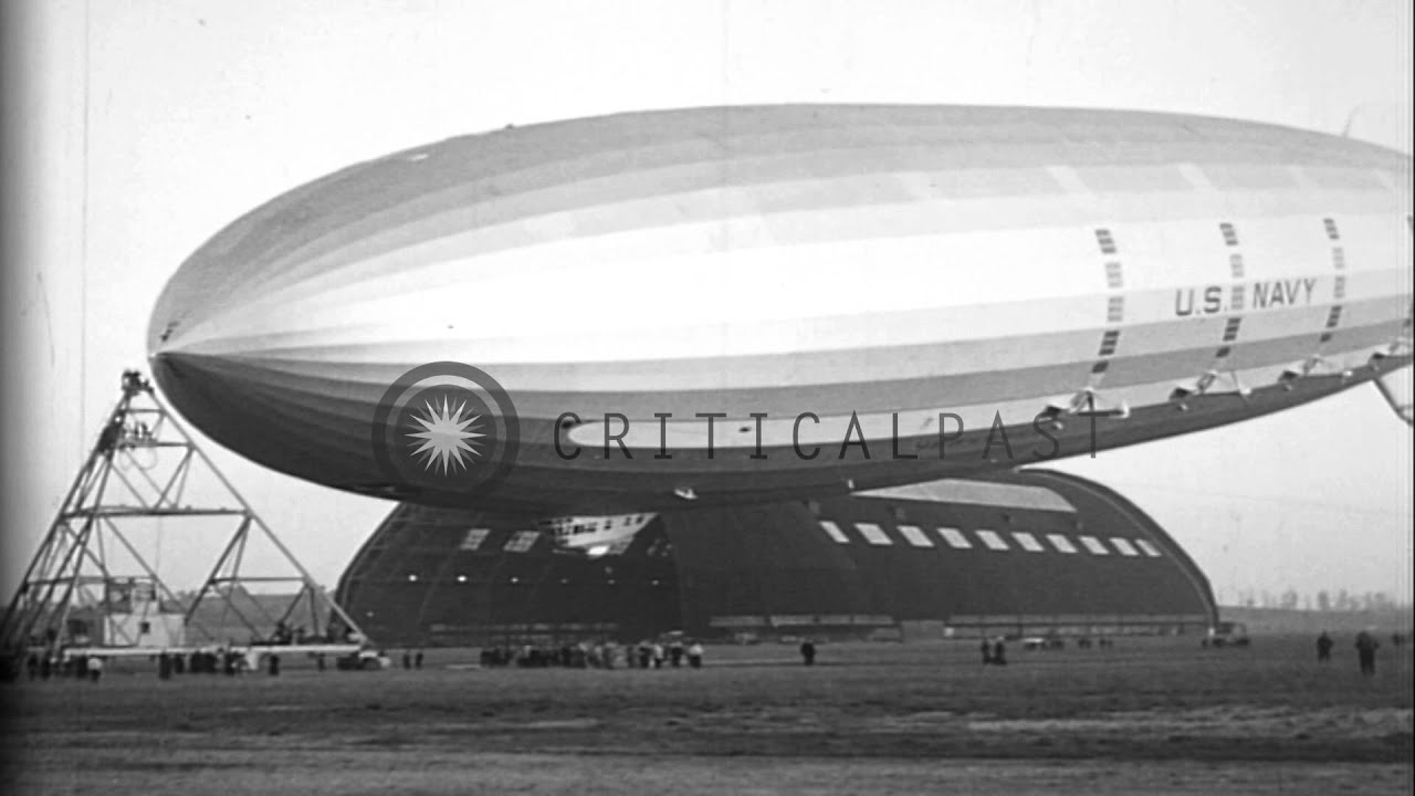 USS Macon is attached to a mooring mast and passengers come ashore in Akron, Ohio...HD Stock Footage