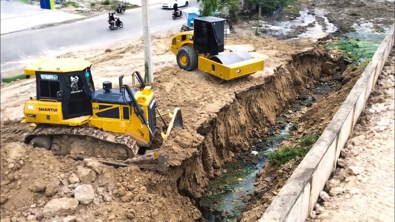 SHANTUI Dozer, Roller And 25T Dump Trucks Completing The Land Out Side The Wall