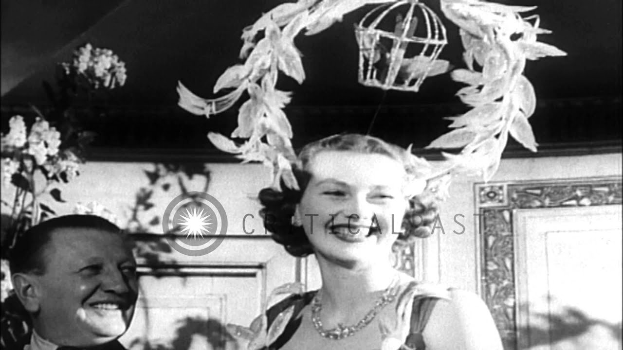 Women display feather bonnets for the city girls club in London, England. HD Stock Footage