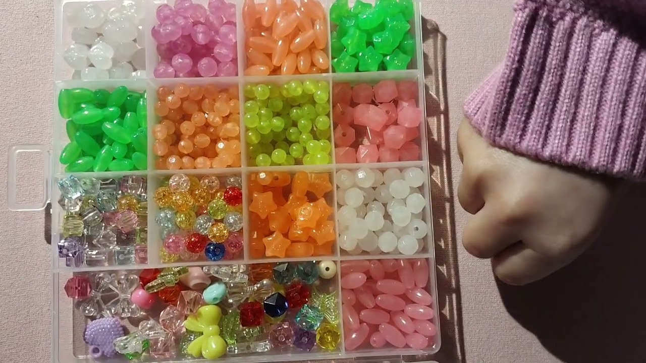 Saishs playing with colourful beads