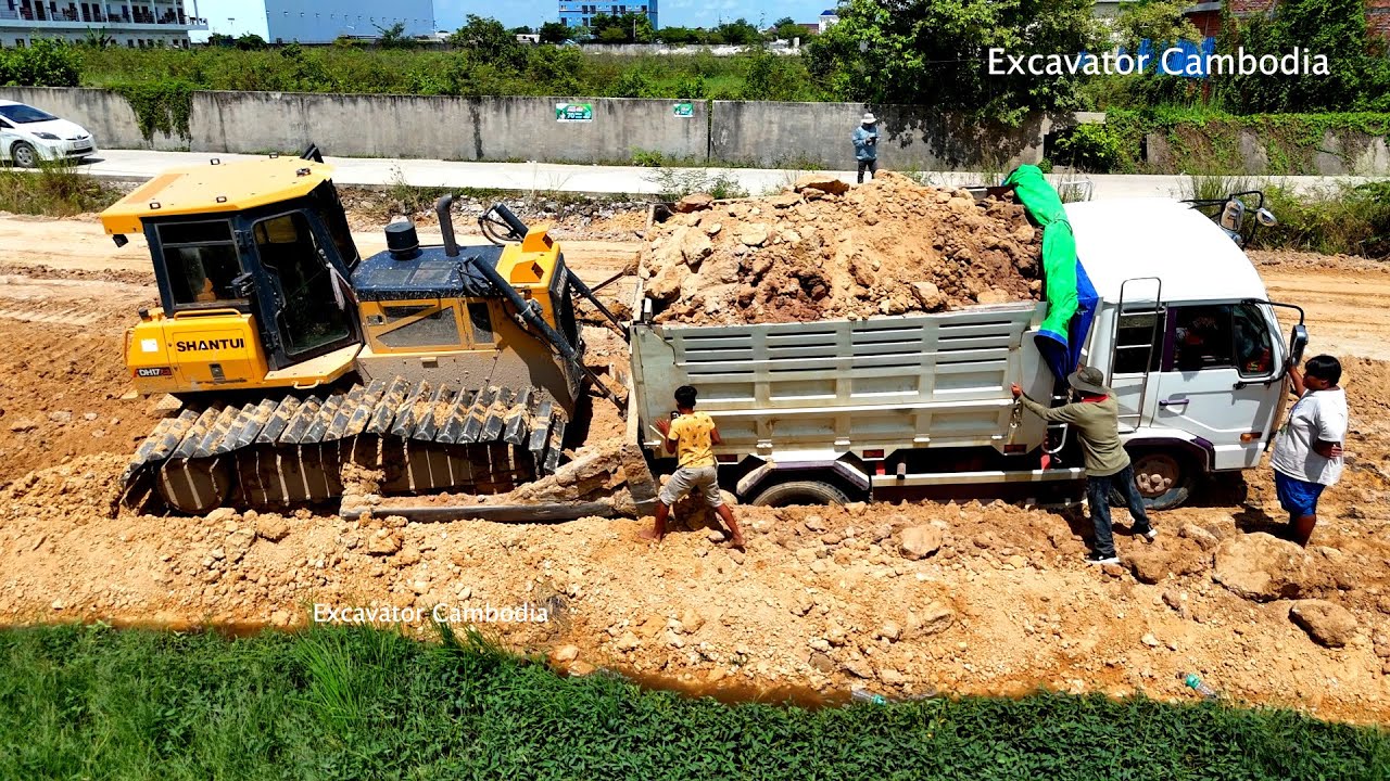 Incredible dump truck drive back stuck wet soil recovery by skill shantui heavy dozer made in china