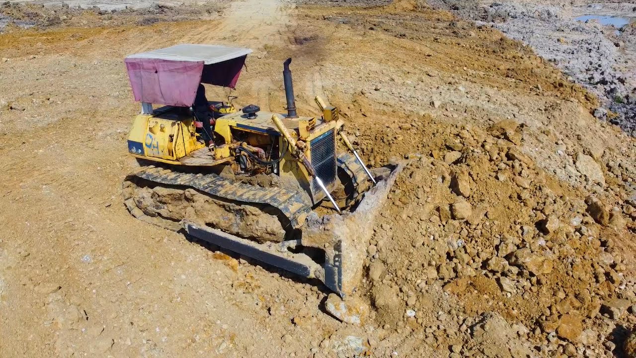 Bulldozer Pushing Dirt & Dump truck Unloading Dirt