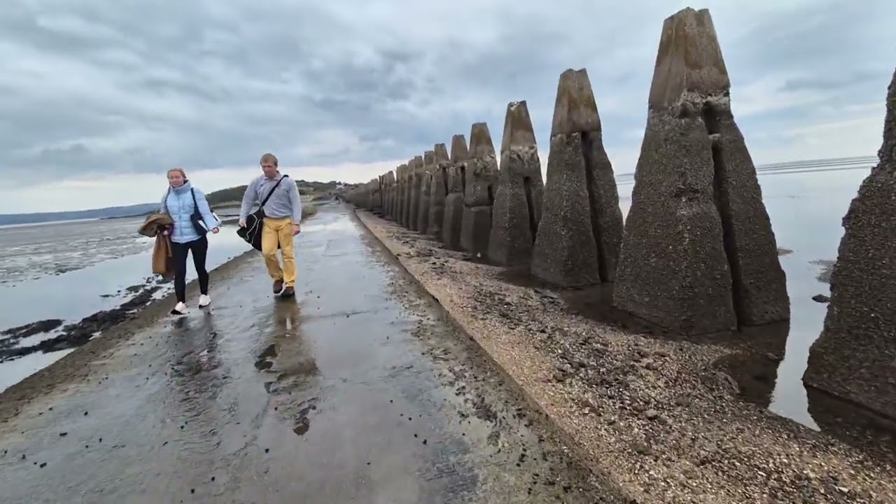 Crossing Cramond causeway, Edinburgh U K