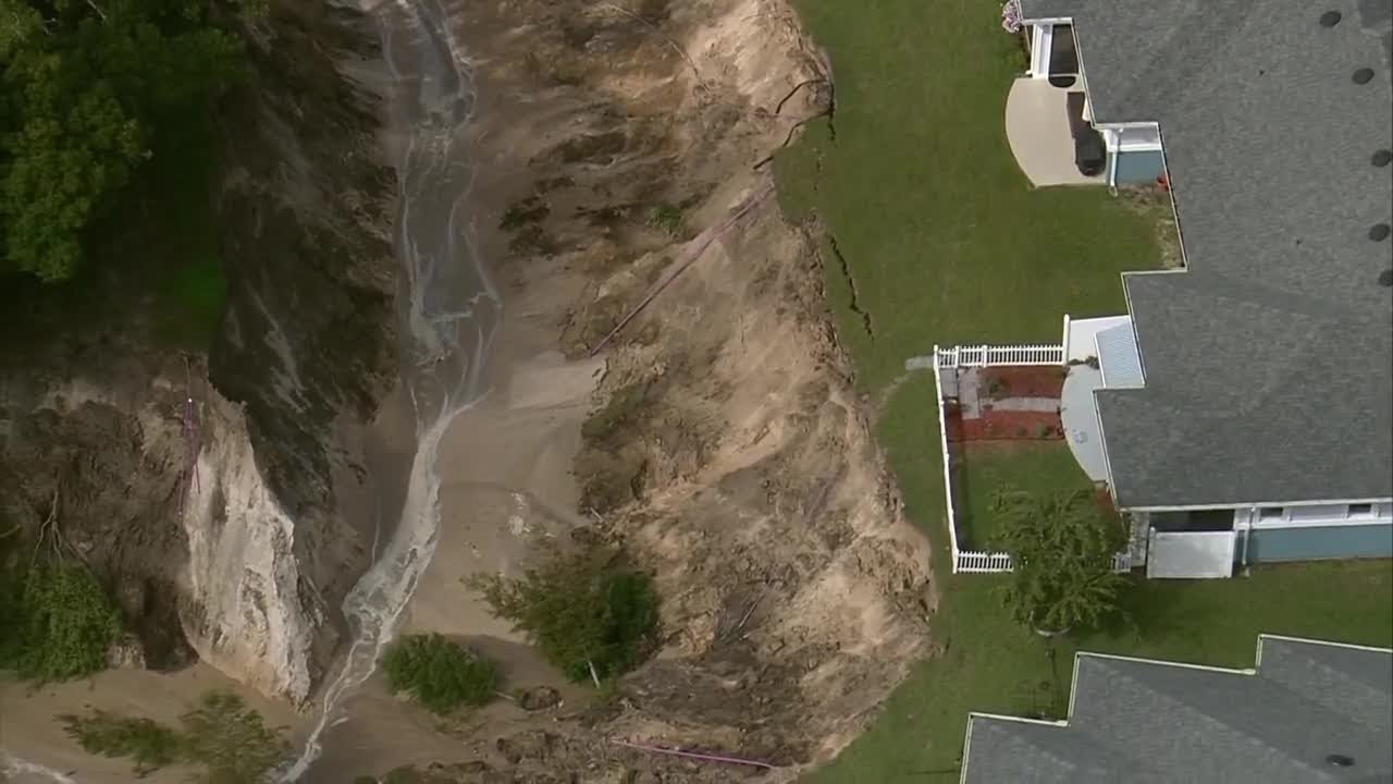 Ground washes out feet away from homes in Lake County after torrential rain