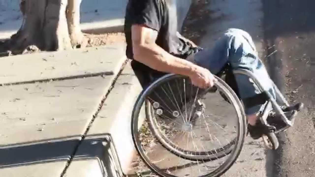 WHEELCHAIR DROPPING OFF A CURB W/ LESS IMPACT. #wheelchair