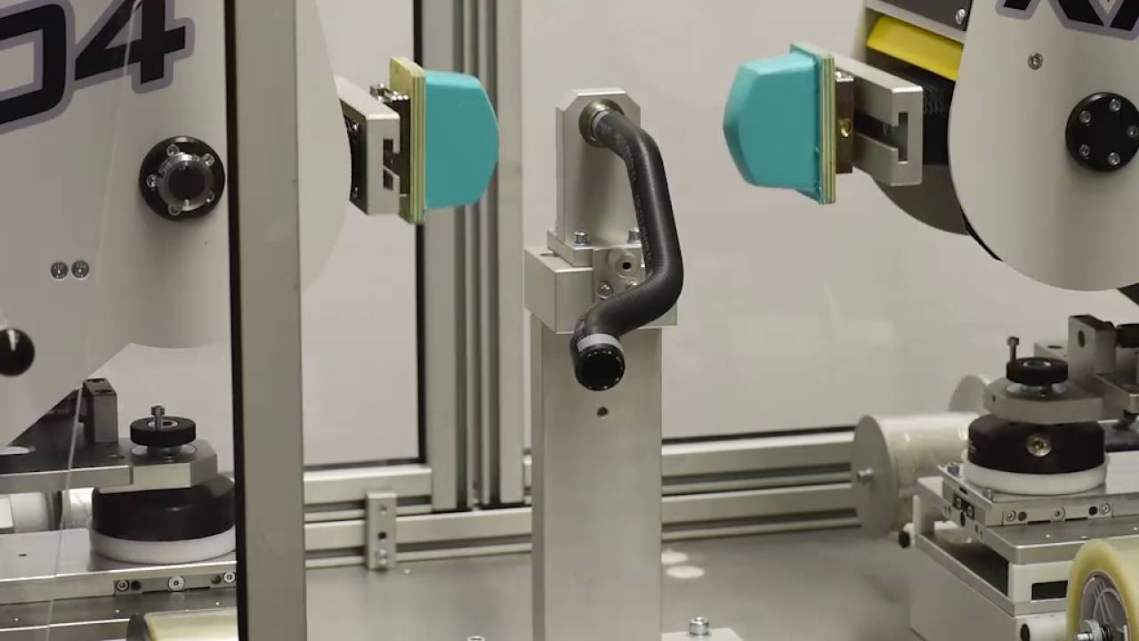 Pad printing machine for rubber hoses