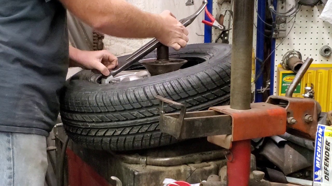 Mounting new tires with an antique Coats 40-40a tire machine