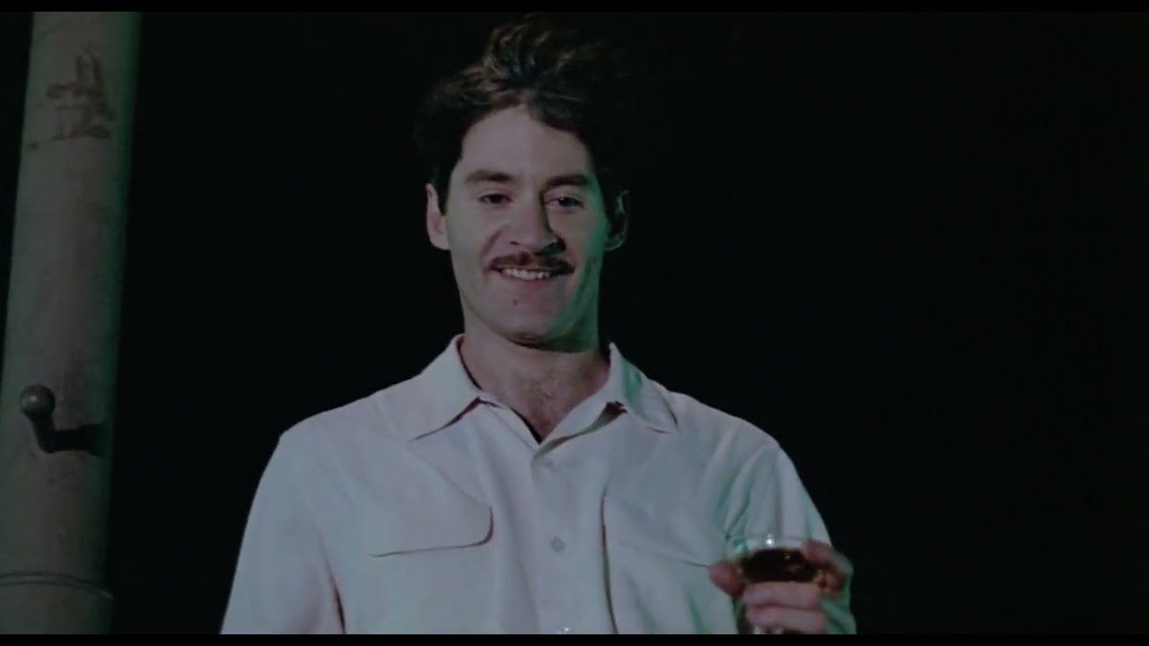 Kevin Kline Toasts to Peter MacNicol in Alan J. Pakula's 