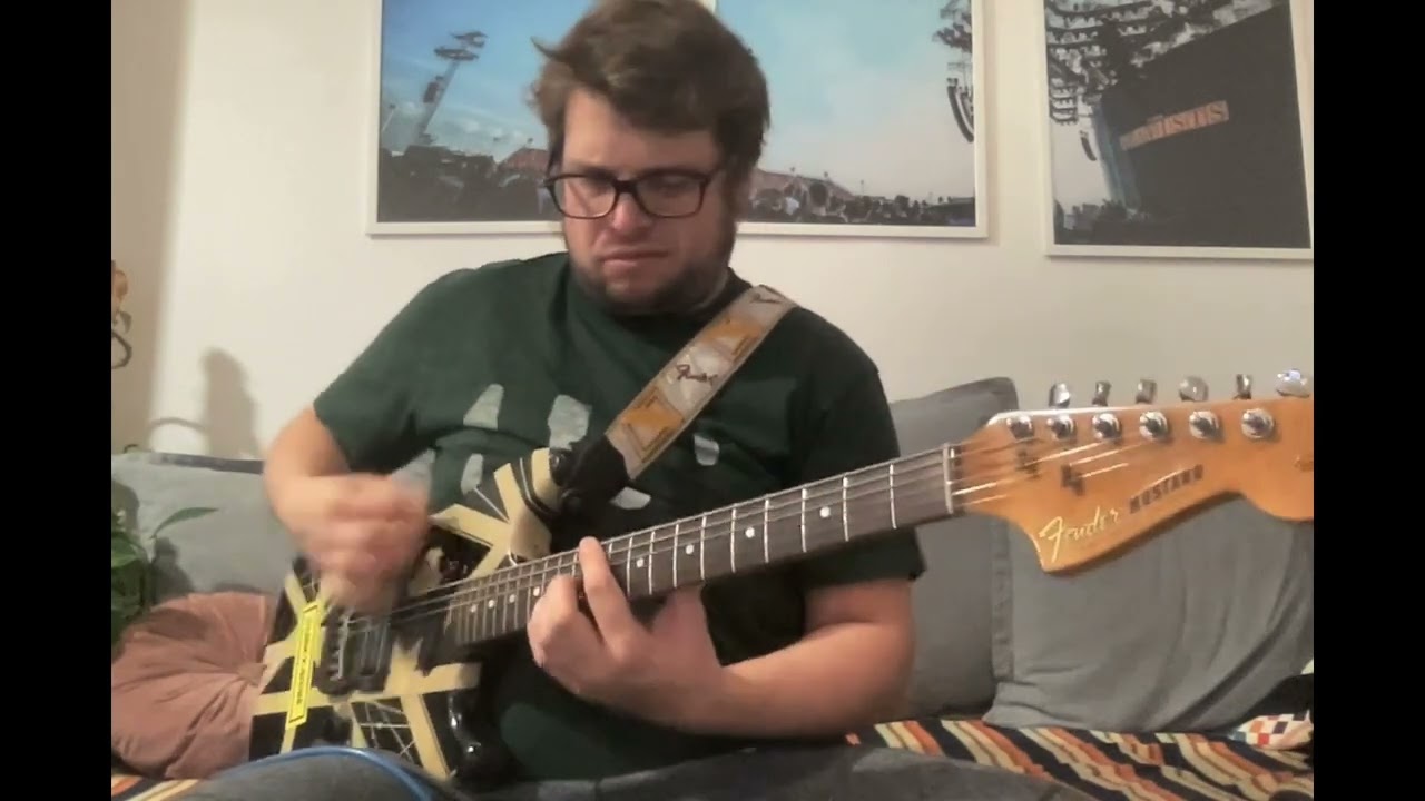 Yikes! Somebody turned this 1965 Fender Mustang into an EVH style abomination!